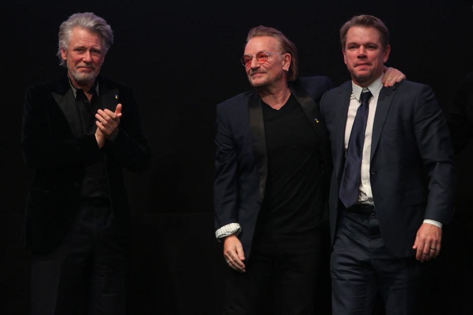 Adam Clayton, Bono i Matt Damon podczas premiery filmu 