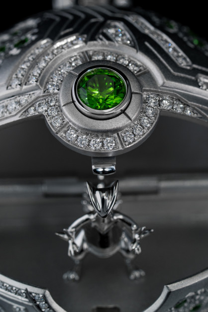 Inside the pendant is a miniature, hand-carved Sceptile figurine. License: Press Kit / Philip Gefaell